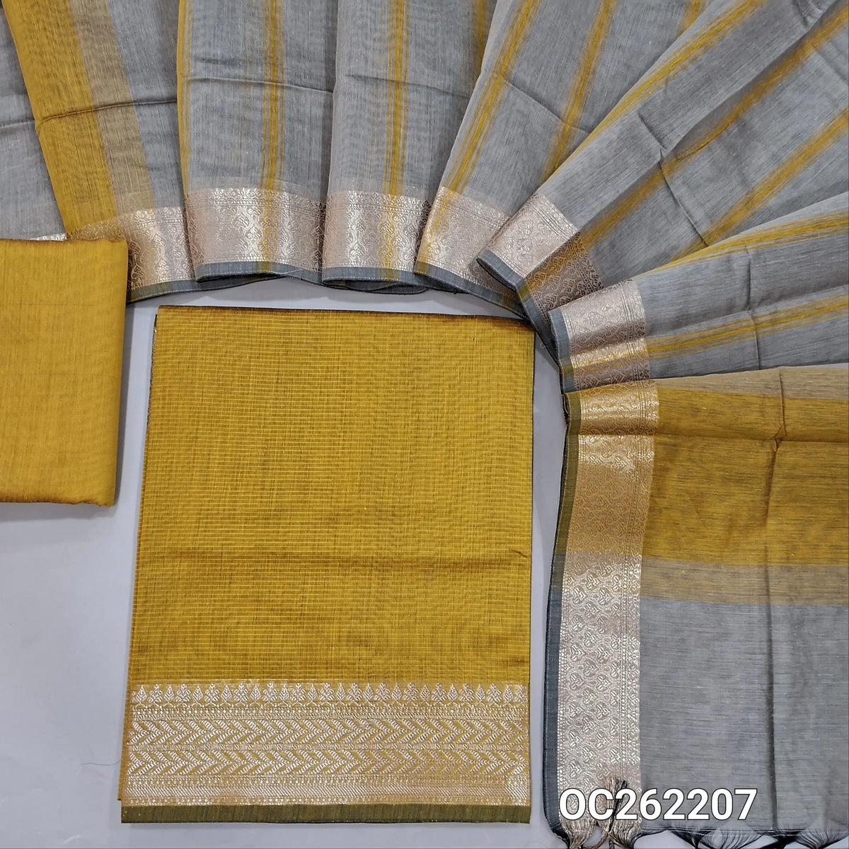 Mehandhi yellow semi Maheshwari silk cotton unstitched salwar material, antic gold zari daman, (lining needed) silk cotton bottom,printed stripes on silk cotton dupatta with zari borders. OC262207