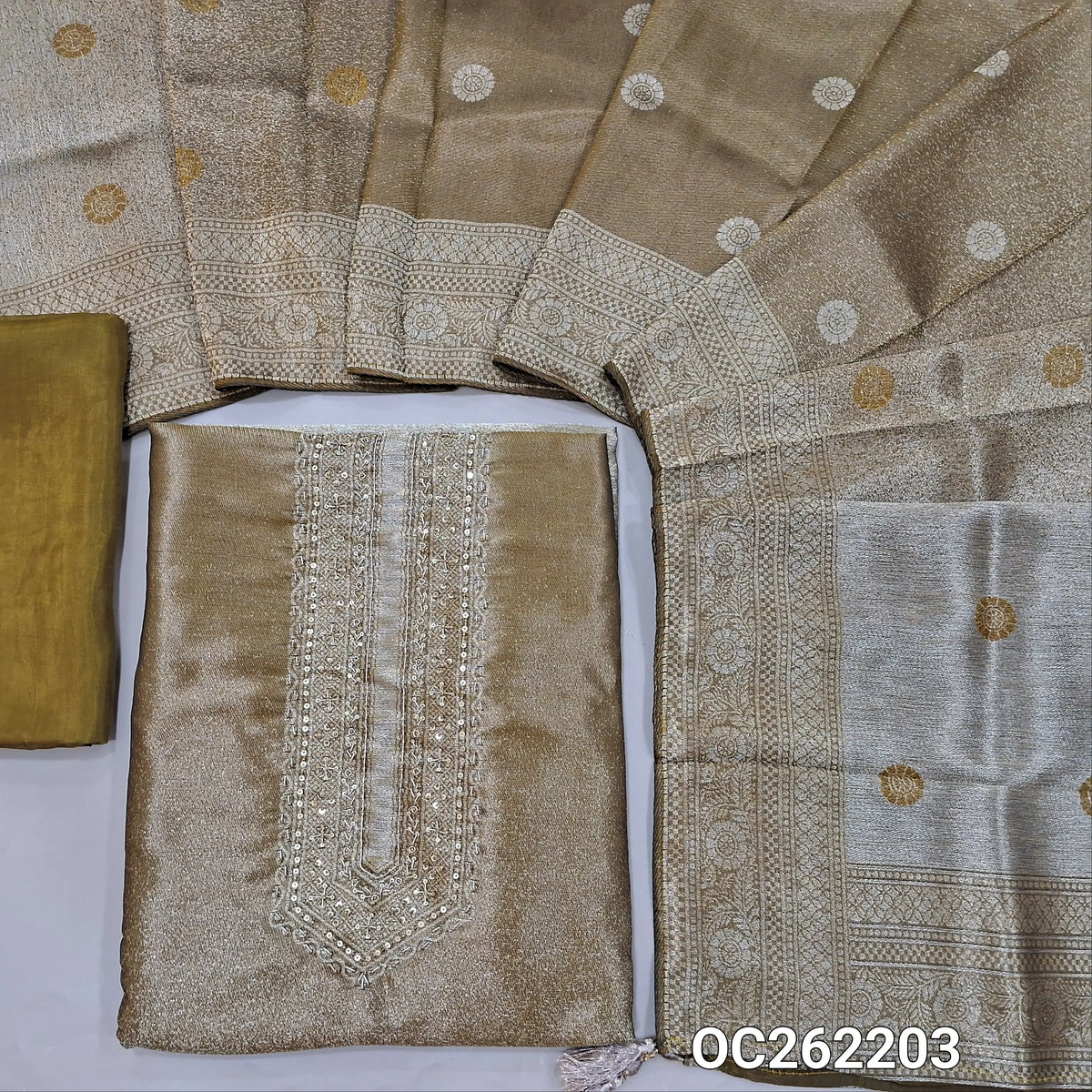Golden beige premium tissue unstitched salwar material,zarodzi and sequins on yoke,zari woven daman,(Shimmer, Lining Needed)premium silk bottom, buttas on dual shaded benarasi tissue dupatta with borders(DRY CLEAN ONLY). OC262203
