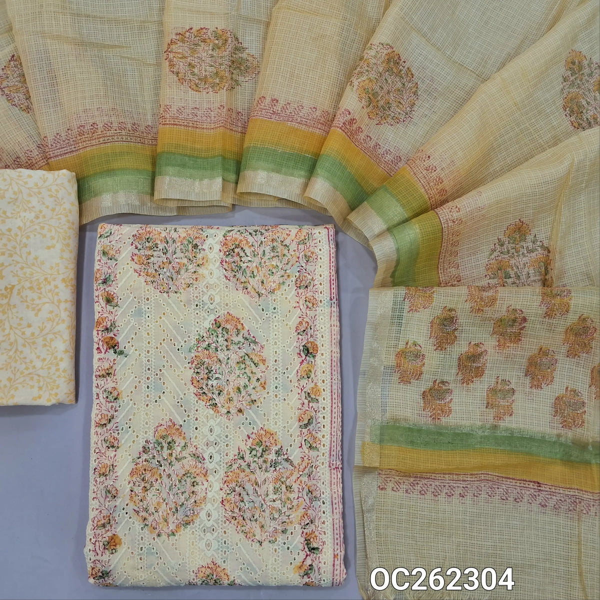 Pastel yellow block printed soft cotton unstitched salwar material, panel design,chikankari embroidery with cutwork on front,(lining needed)block printed mul cotton bottom, block printed kota dupatta with tissue borders. OC262304