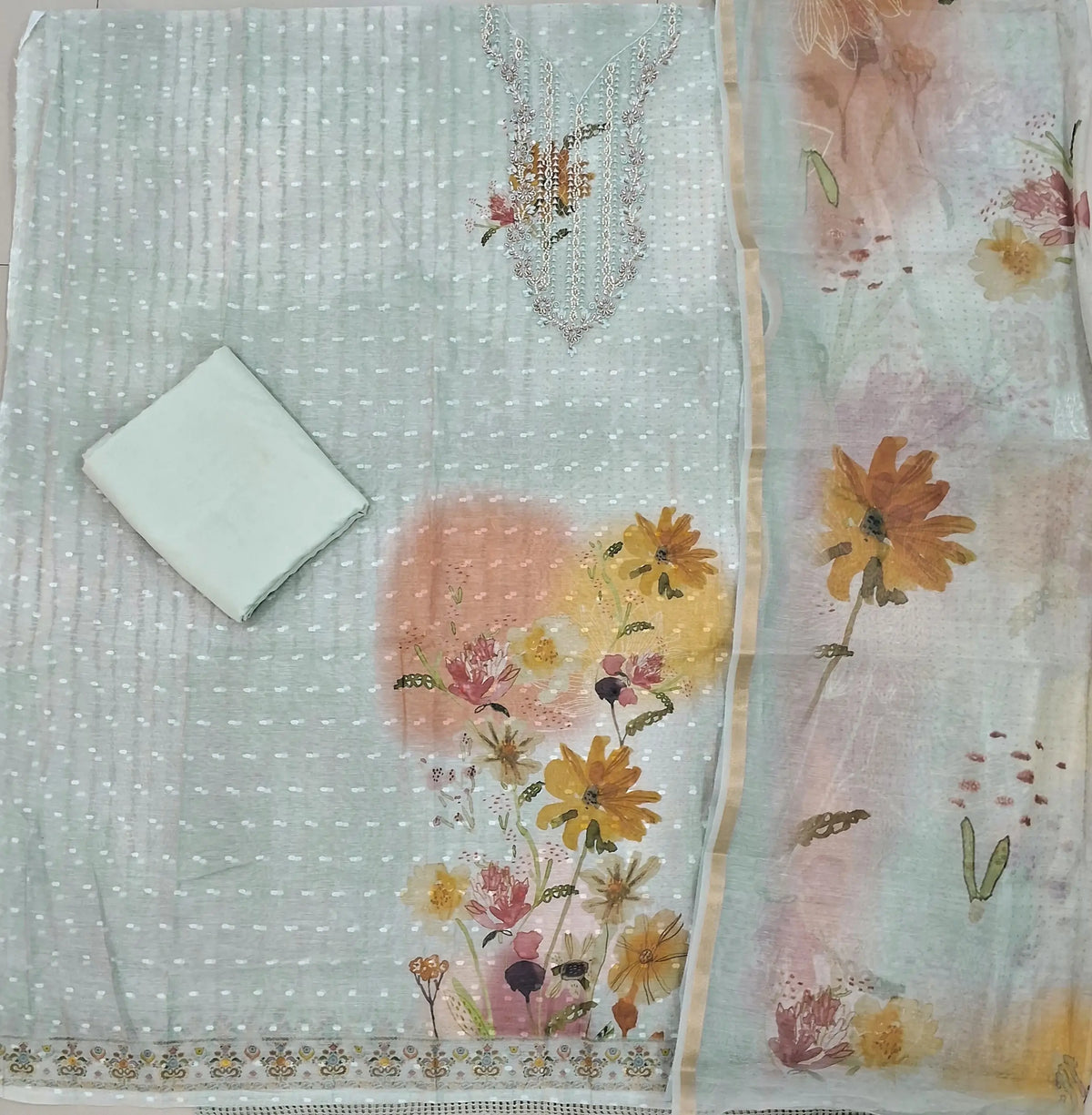 Pale blueish grey premium silk cotton unstitched salwar material,sugar bead & thread work yoke, thread buttas all over &  printed daman,(lining needed)silky fabric for lining & bottom, digital printed silk cotton dupatta with tissue borders. OC262302