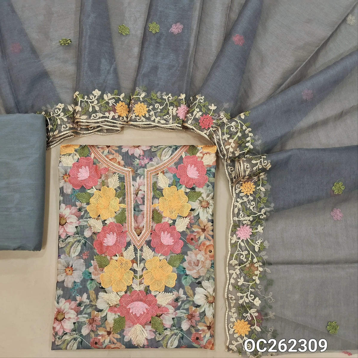 Blueish grey digital printed premium silk cotton unstitched salwar material,thread embroidery on yoke,(lining needed)matching siky fabric provided for both bottom and lining,organza dupatta with embroidery borders. OC262309