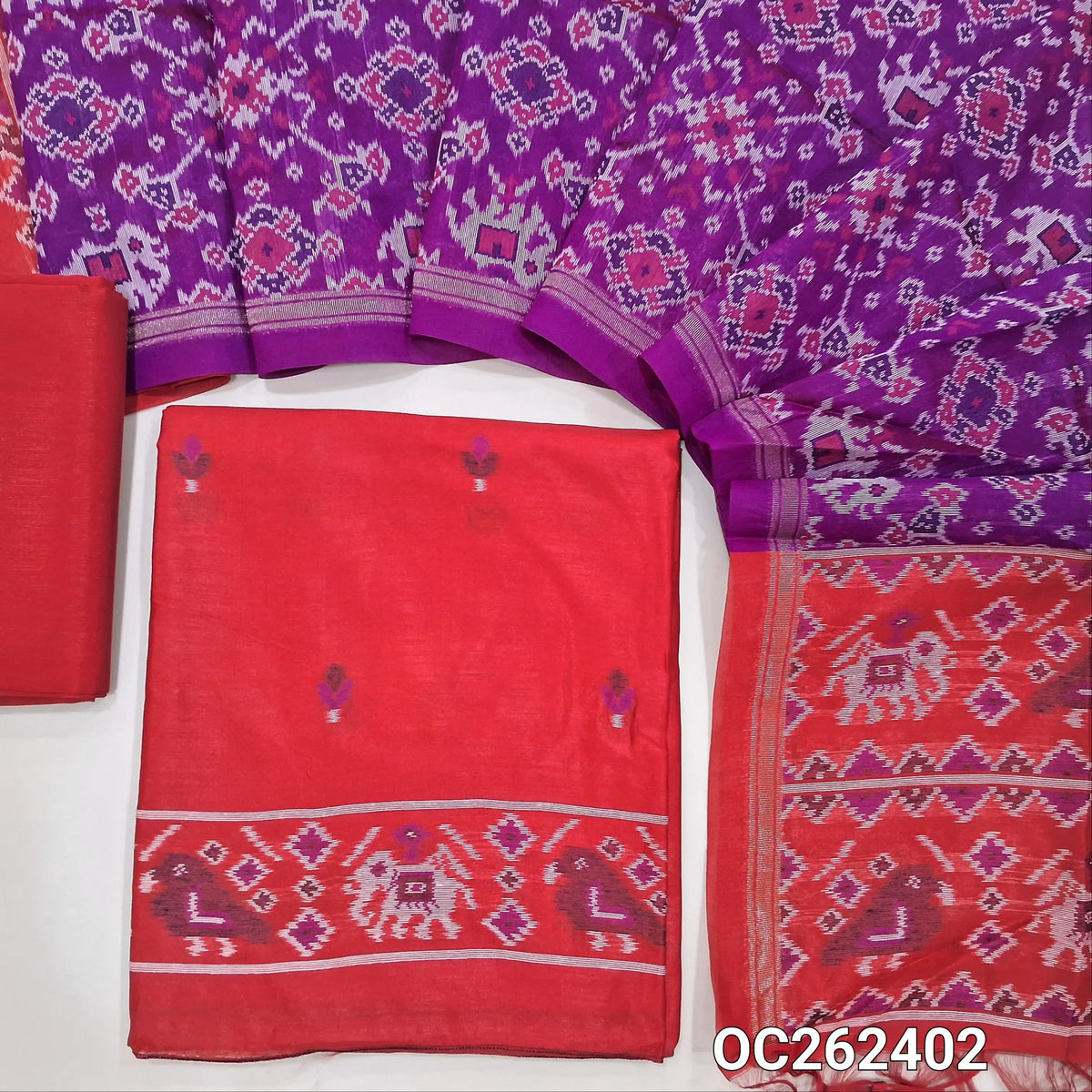 Bright red premium silk cotton unstitched salwar material,floral buttas on front,patola weaving on daman,(lining needed)silk cotton bottom, patola weaving on full length silk cotton dupatta with contrast pallu and tassels. OC262402