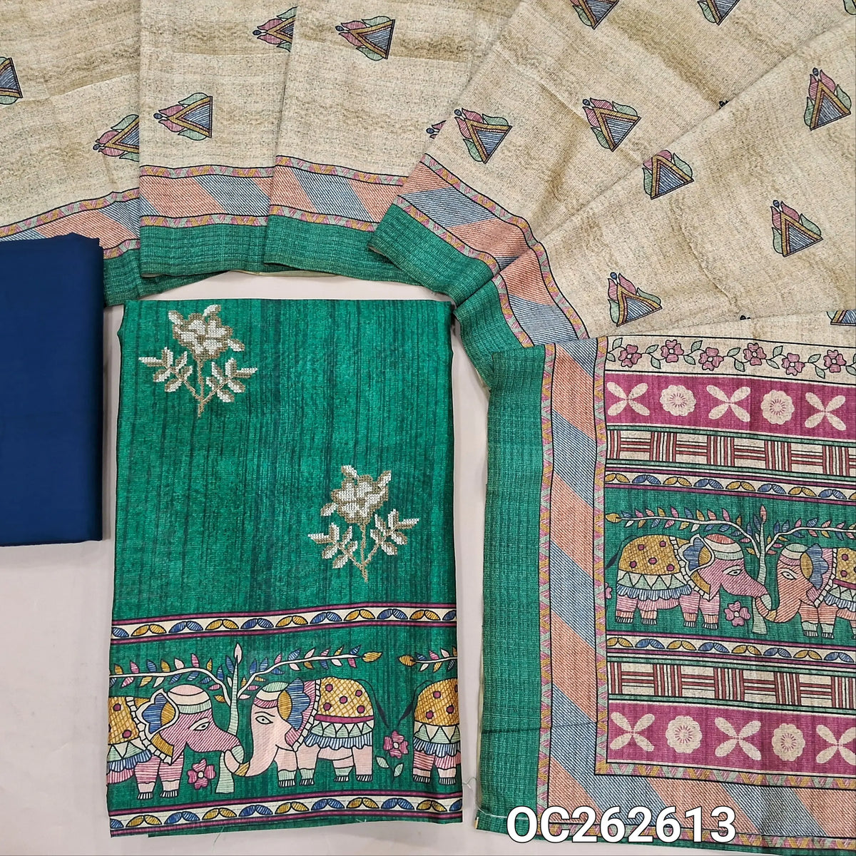 Bottle green semi tussar unstitched salwar material,cross stitch work on front,madhubani printed daman,(lining needed)blue spun cotton bottom,digital printed semi tussar dupatta with elephant printed pallu. OC262613