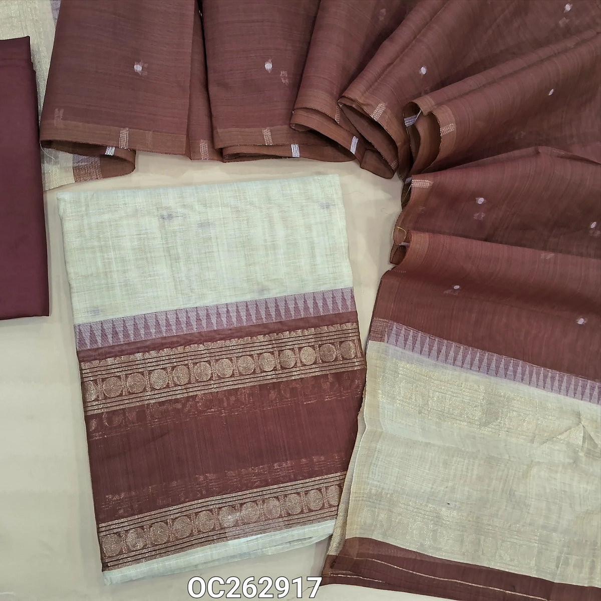 Off white and dark onion pink silk cotton unstitched salwar material, gap bordes with temple weaving on daman, zari weaving on yoke (Thin, Lightweight, Lining Needed) silky bottom, silk cotton dupatta with thread woven buttas. OC262917
