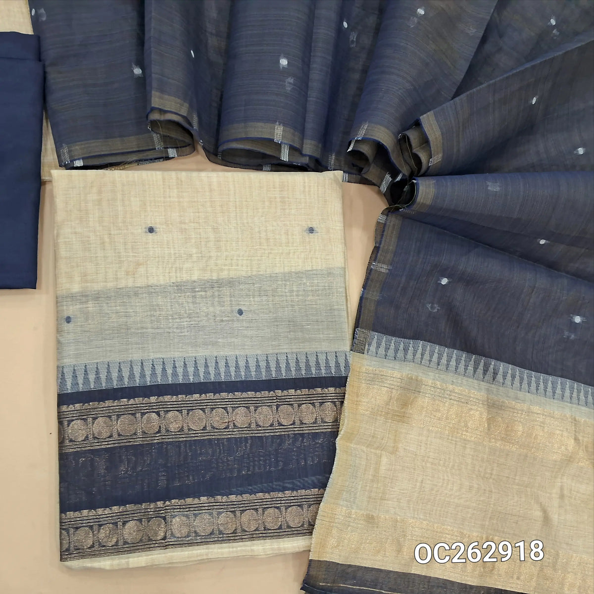 Off white and dark blue silk cotton unstitched salwar material, gap bordes with temple weaving on daman, zari weaving on yoke (Thin, Lightweight, Lining Needed) silky bottom, silk cotton dupatta with thread woven buttas. OC262918