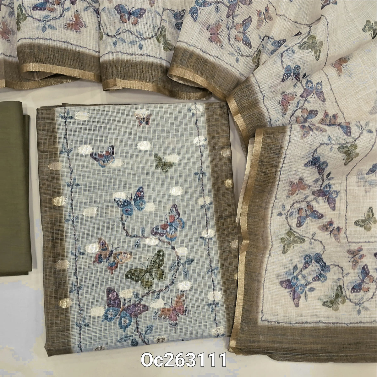 Olive green kota digital printed unstitched salwar material, zari woven buttas all over (Thin, Lightweight, Lining Needed) matching silky bottom, printed kota dupatta. OC263111