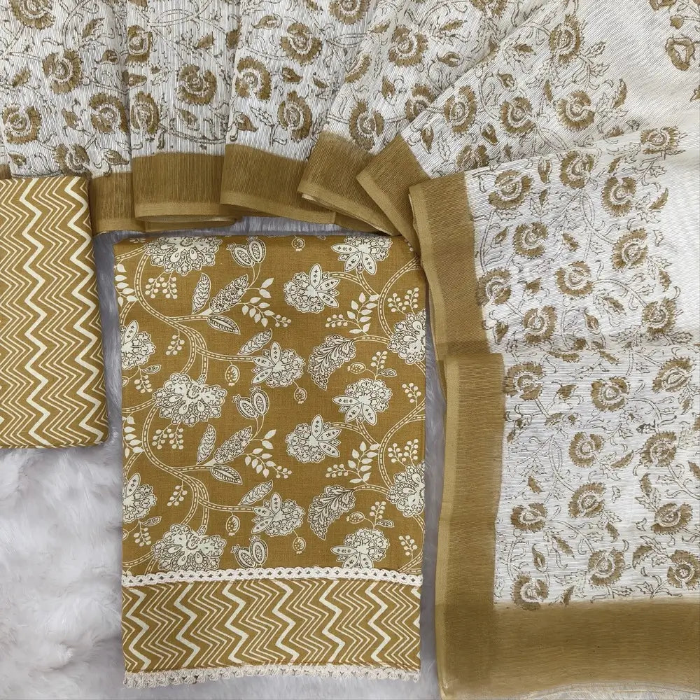 Light mehandhi yellow floral printed soft cotton unstitched salwar material, lace work on daman(lining optional)zigzag printed cotton bottom, block printed fancy super net dupatta(REQUIRES TAPINGS). CODE MY250722