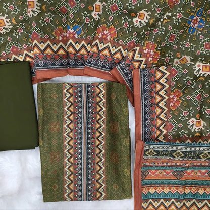 Digital printed olive Green silk cotton unstitched salwar material (lining needed) sequins, bead work on yoke, matching spun cotton bottom, digital printed silk cotton dupatta. NV253002