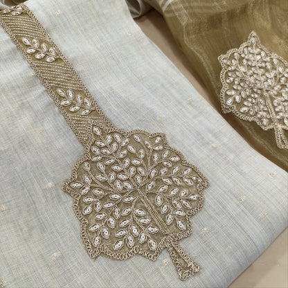 Rich beige premium silk cotton unstitched salwar material,zarodzi and zari work on yoke, zari buttas all over,(lining needed)rich daman, spun cotton bottom, designer premium silk cotton dupatta with rich pallu. JL261701