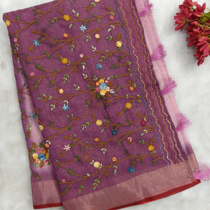 Purple with golden tint premium dual shaded tissue linen saree, with rich hand embroidery work all over(texture)double side tissue borders,contrast pallu, with rich hand embroidery and sequins work, running blouse with embroidery & borders. NS265