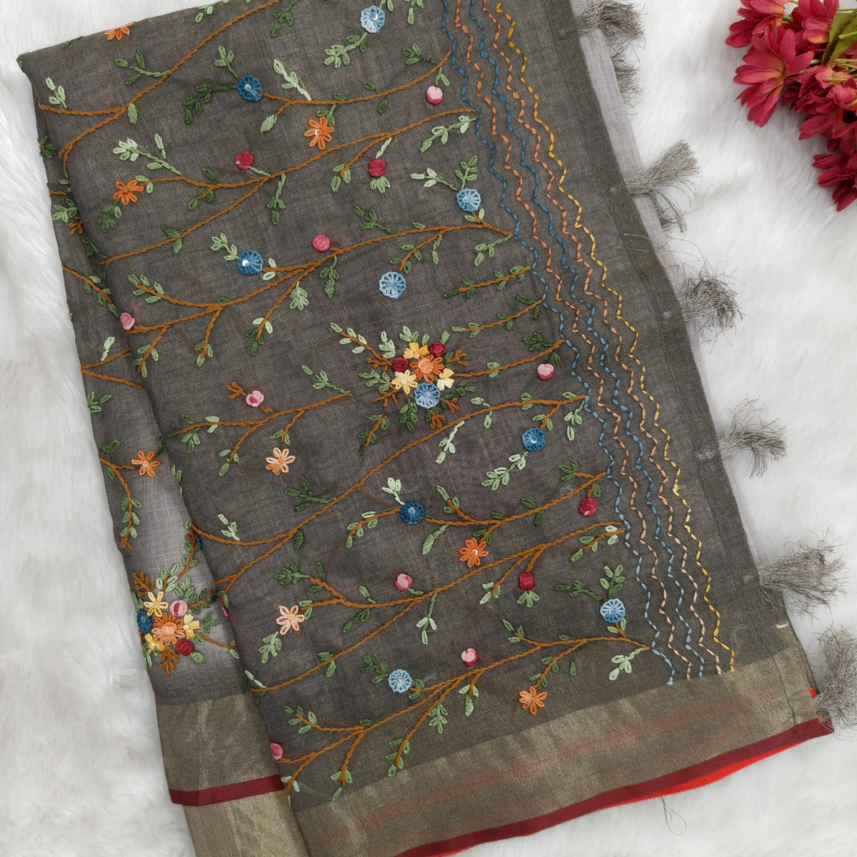 Grey with golden tint premium dual shaded tissue linen saree, with rich hand embroidery detailing all over(textured)double side tissue borders,contrast pallu, with rich hand embroidery and sequins work, running blouse with embroidery & borders. NS267