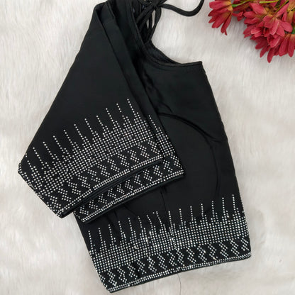 CODE WS1132 : Black designer crepe silk saree with heavy and neat dew drop stone work for borders and pallu, readymade blouse (can be altered upto size 40).