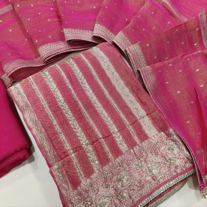 Bright pink with golden tint jakard tissue silk cotton unstitched salwar material,self design all over,cut bead and zardozi work on front, panel design, (Lining Needed)santoon bottom, tissue silk dupatta with zari woven borders. AG260801