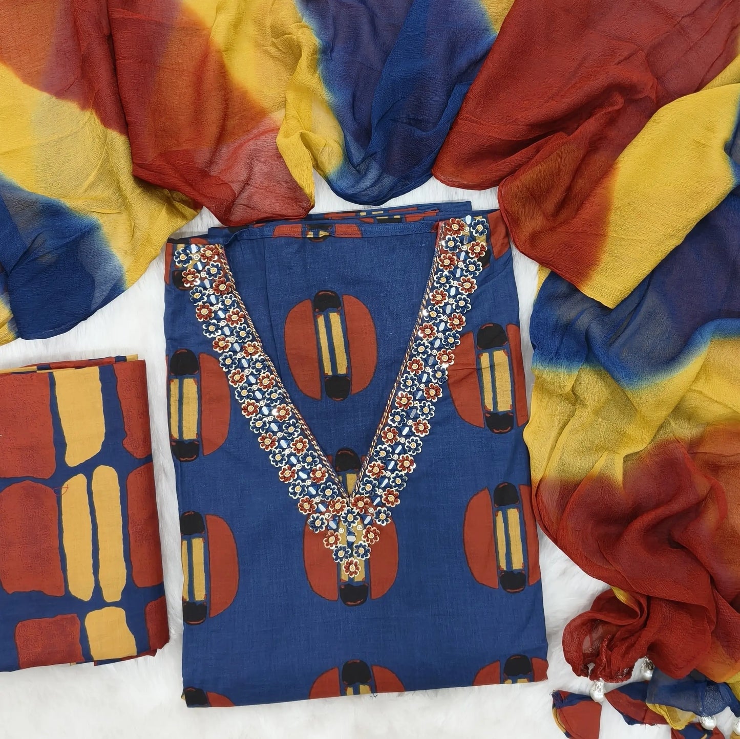 Blue block printed premium cotton unstitched salwar material, V neck with thread, sequins and real mirror on yoke (lining optional) block printed cotton bottom, multicoloured lehariya printed pure chiffon dupatta. AP261410