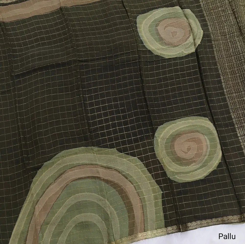 Dark Olive Green Viscous Chanderi silk saree with shibori prints all over and zari checks all over, thin zari woven borders and running viscous chanderi zari woven blouse. NS57