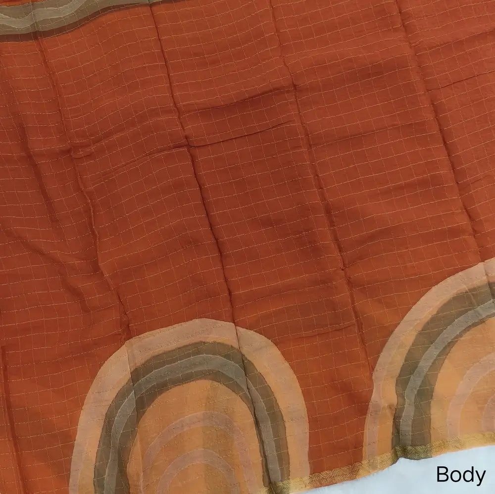 Rust Orange Viscous Chanderi silk saree with shibori prints all over and zari checks all over, thin zari woven borders and running viscous chanderi zari woven blouse. NS58