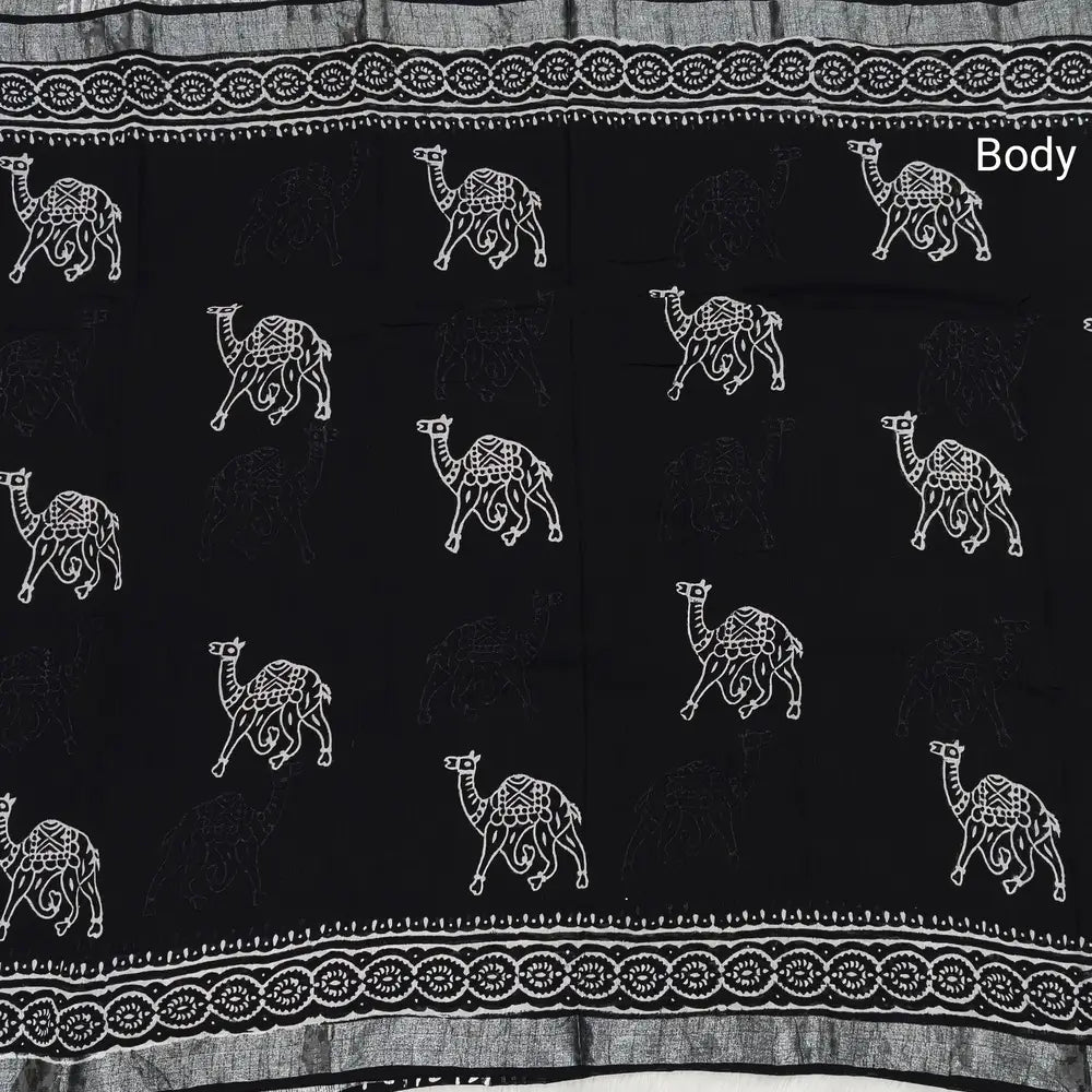 Black block printed linen cotton saree with double side silver zari borders (lightweight,soft) printed pallu with silver zari stripes, plain running blouse with borders. NS62