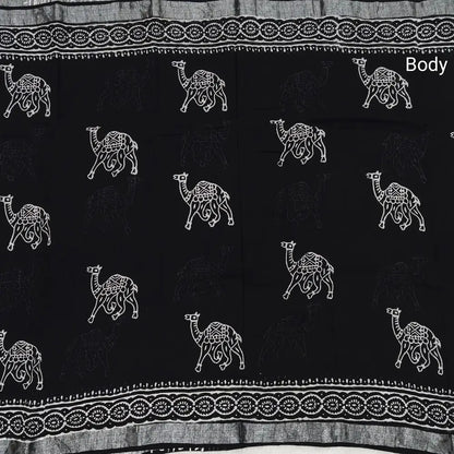 Black block printed linen cotton saree with double side silver zari borders (lightweight,soft) printed pallu with silver zari stripes, plain running blouse with borders. NS62
