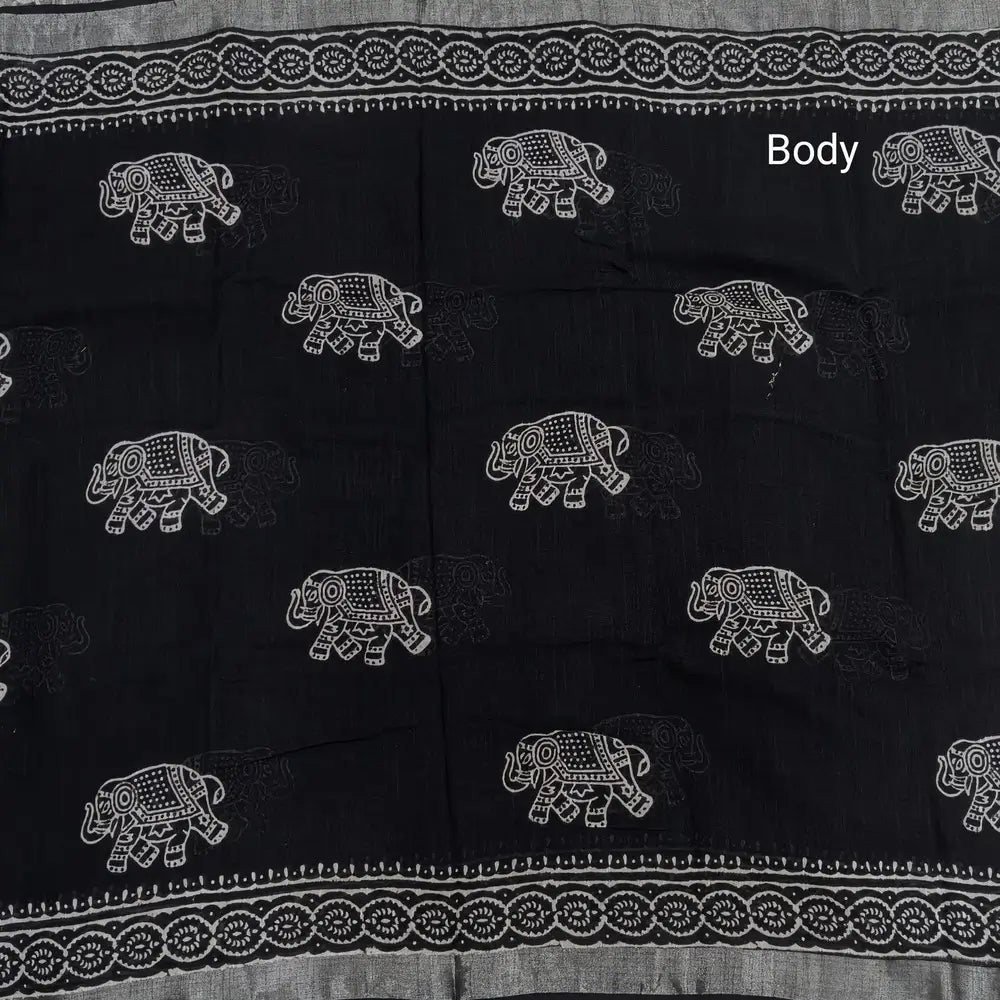 Black block printed linen cotton saree with double side silver zari borders (lightweight,soft) printed pallu with silver zari stripes, plain running blouse with borders. NS63