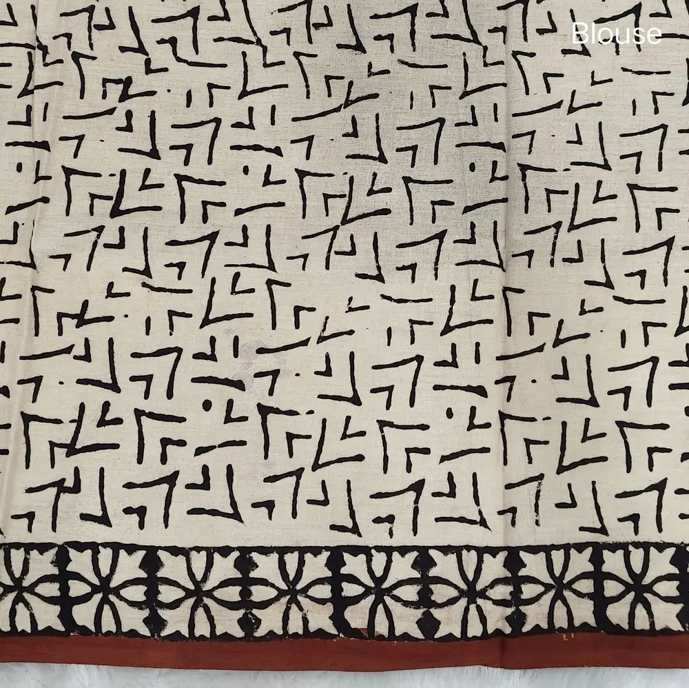 Reddish maroon kalamkari hand block printed cotton saree, printed pallu and kalamkari printed blouse with borders. INCONSISTENT PRINTS AND DYES ARE NOT DEFECTS.NS65