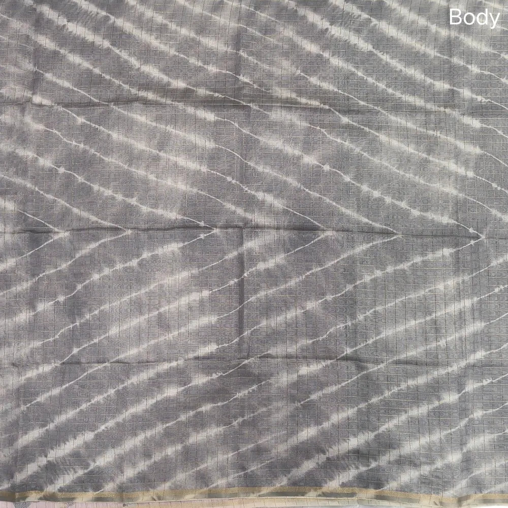 Light grey with pastel pink shibori printed soft silk cotton saree with zari checks all over, contrast animal prints on pallu, contrast running blouse with zari chceks and borders.NS67