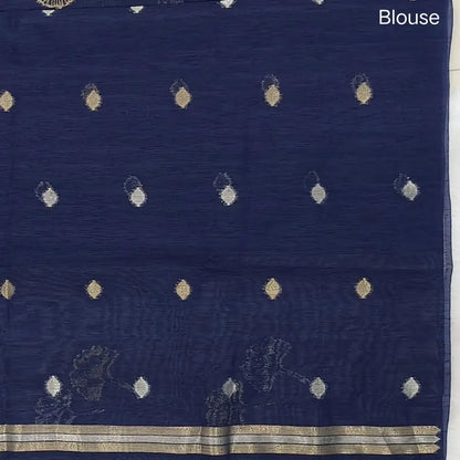 Dark blue premium tussar jamdani saree with gold and silver zari weaving all over, rich weaving on pallu, running blouse with zari woven buttas and borders. NS78