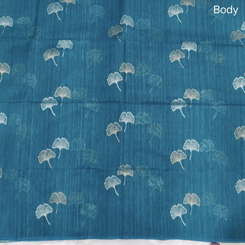 Turquoise blue premium tussar jamdani saree with gold and silver zari weaving all over, rich weaving on pallu, running blouse with zari woven buttas and borders. NS76