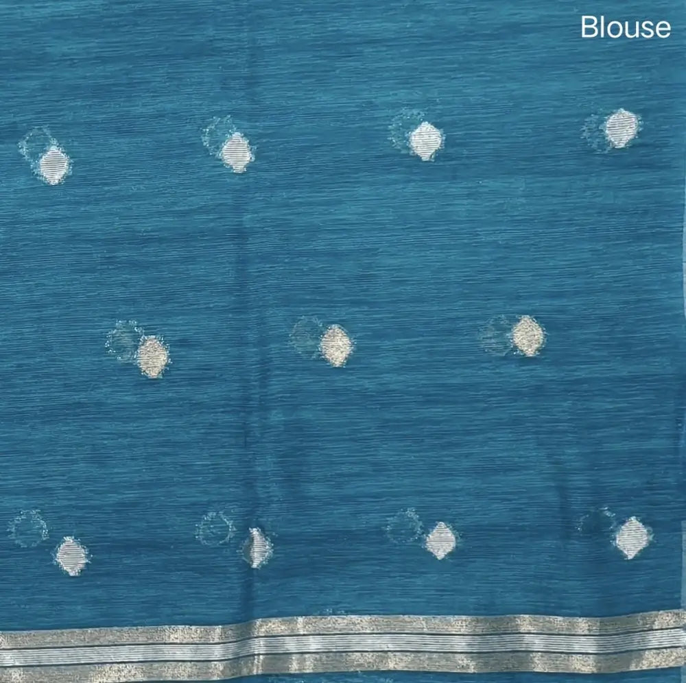 Turquoise blue premium tussar jamdani saree with gold and silver zari weaving all over, rich weaving on pallu, running blouse with zari woven buttas and borders. NS76