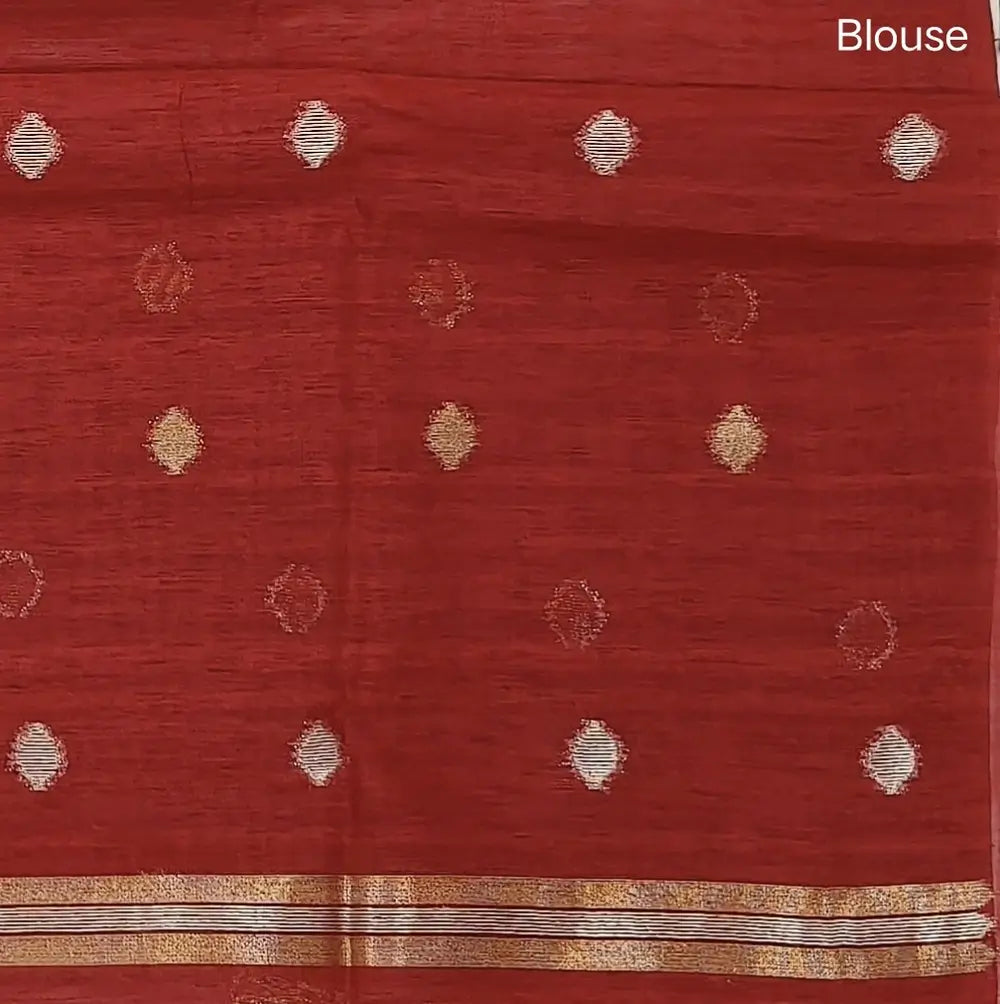 Bright red premium tussar jamdani saree with gold and silver zari weaving all over, rich weaving on pallu, running blouse with zari woven buttas and borders. NS77
