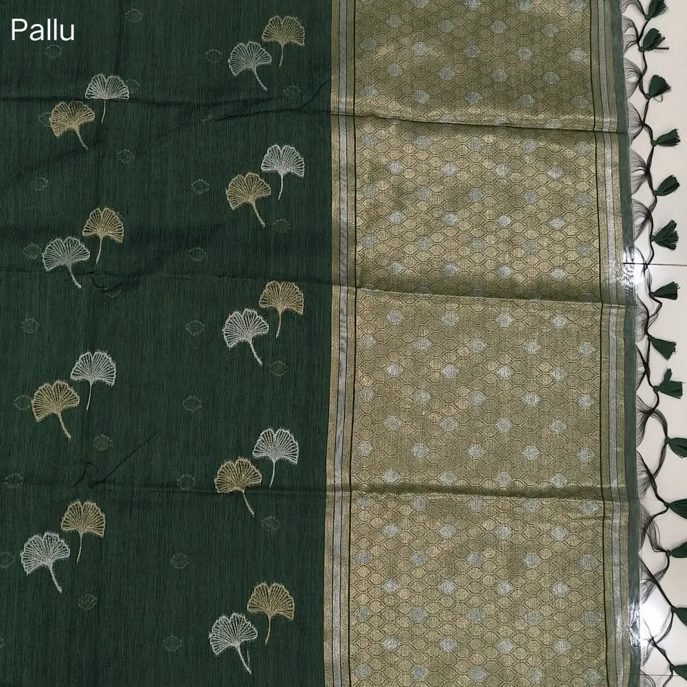 Bottle green premium tussar jamdani saree with gold and silver zari weaving all over, rich weaving on pallu, running blouse with zari woven buttas and borders. NS75