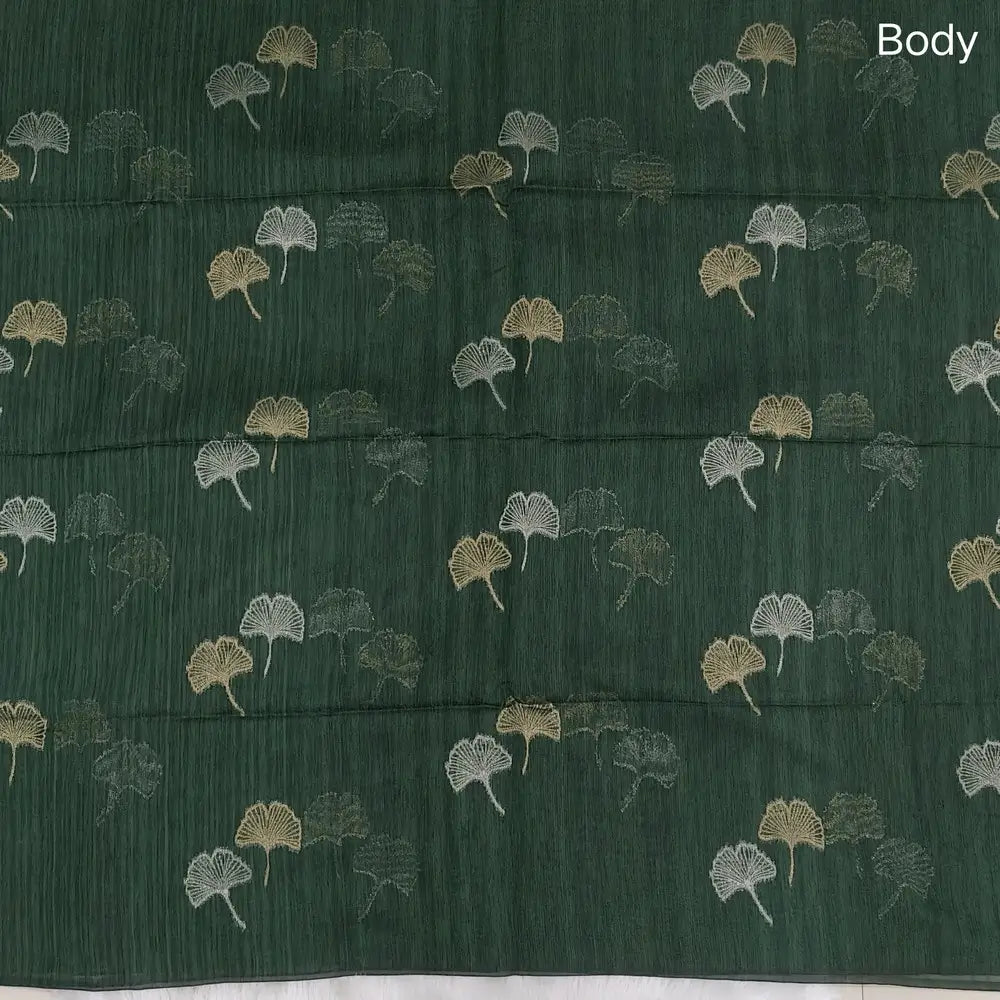 Bottle green premium tussar jamdani saree with gold and silver zari weaving all over, rich weaving on pallu, running blouse with zari woven buttas and borders. NS75