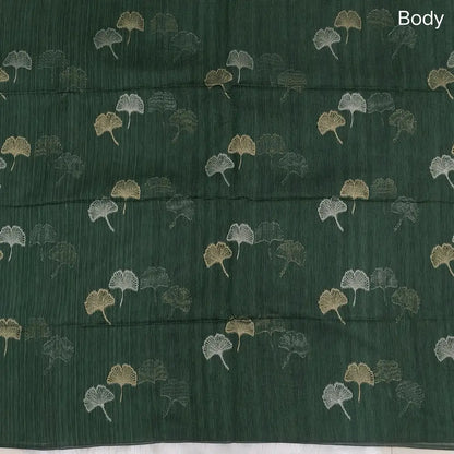 Bottle green premium tussar jamdani saree with gold and silver zari weaving all over, rich weaving on pallu, running blouse with zari woven buttas and borders. NS75