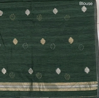 Bottle green premium tussar jamdani saree with gold and silver zari weaving all over, rich weaving on pallu, running blouse with zari woven buttas and borders. NS75