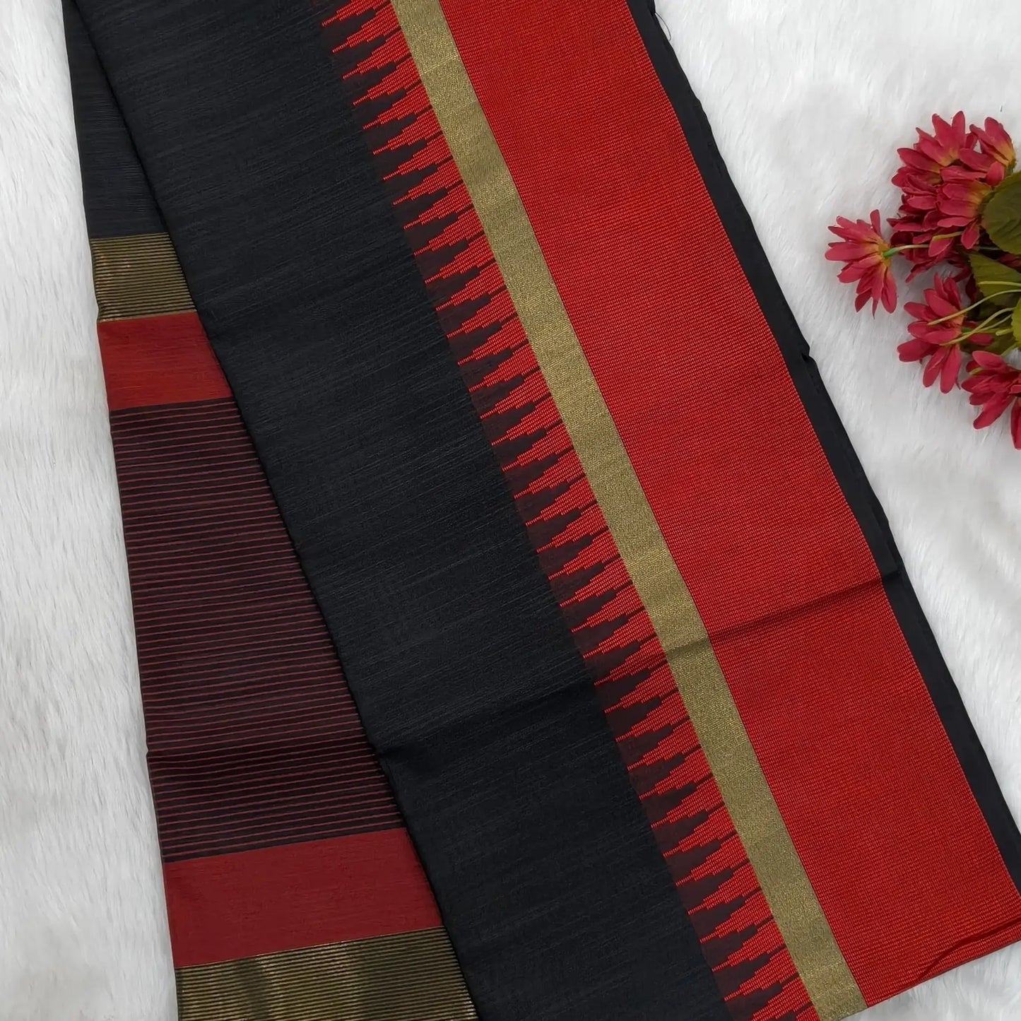 Black with maroon silk cotton saree with thread woven double side borders, zari striped short pallu and contrast blouse with borders. NS84