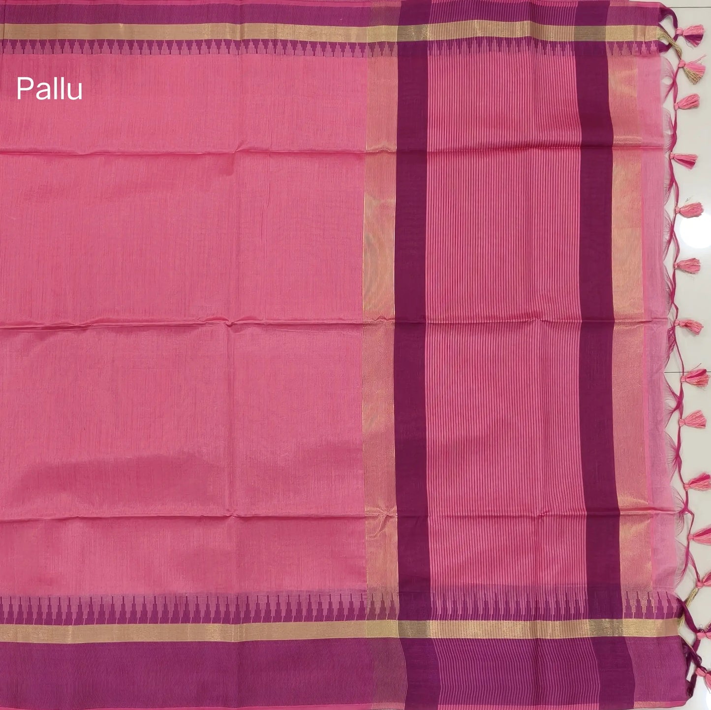 Pink with beetroot purple silk cotton saree with thread woven double side borders, zari striped short pallu and contrast blouse with borders. NS79