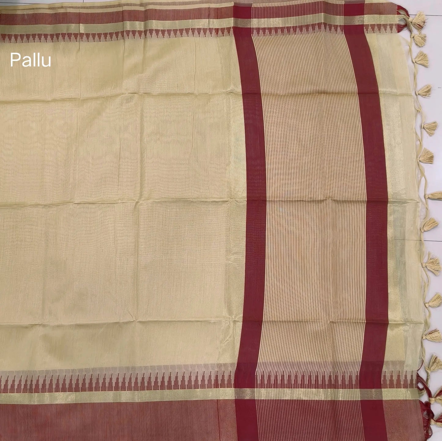 Beige with dark maroon silk cotton saree with thread woven double side borders, zari striped short pallu and contrast blouse with borders. NS80