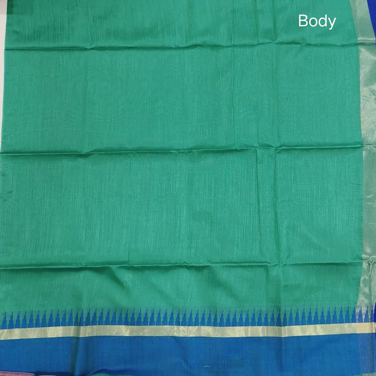 Teal green with ink blue silk cotton saree with thread woven double side borders, zari striped short pallu and contrast blouse with borders. NS83