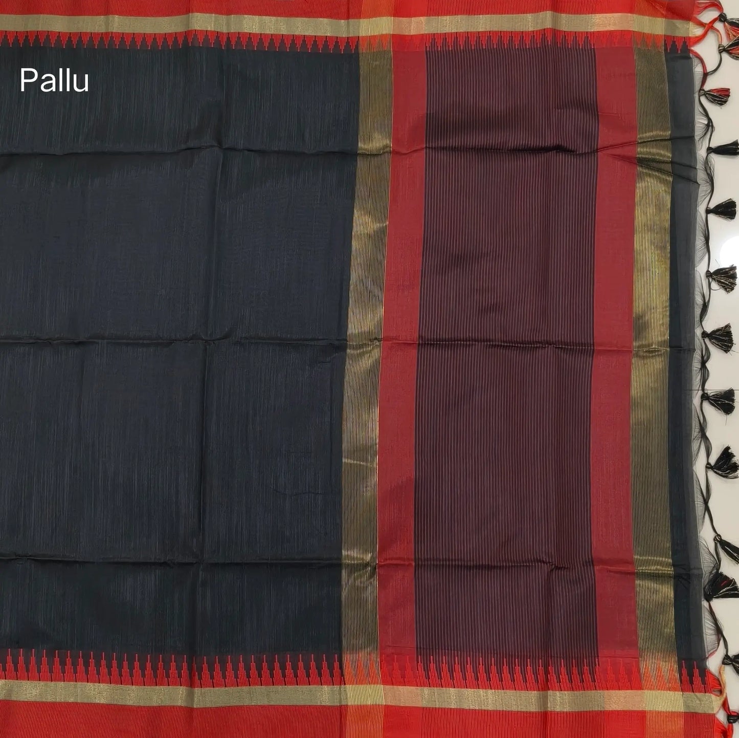 Black with maroon silk cotton saree with thread woven double side borders, zari striped short pallu and contrast blouse with borders. NS84