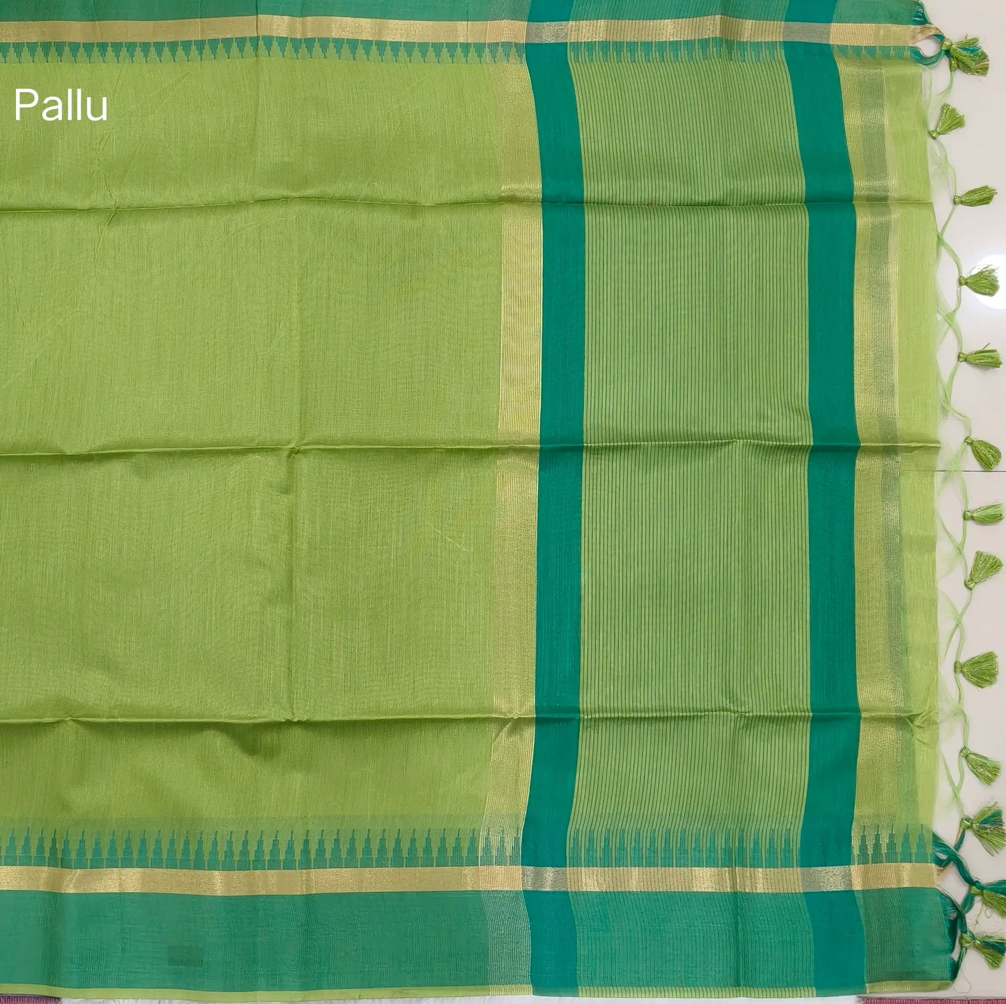 Light green with turquoise green silk cotton saree with thread woven double side borders, zari striped short pallu and contrast blouse with borders. NS81