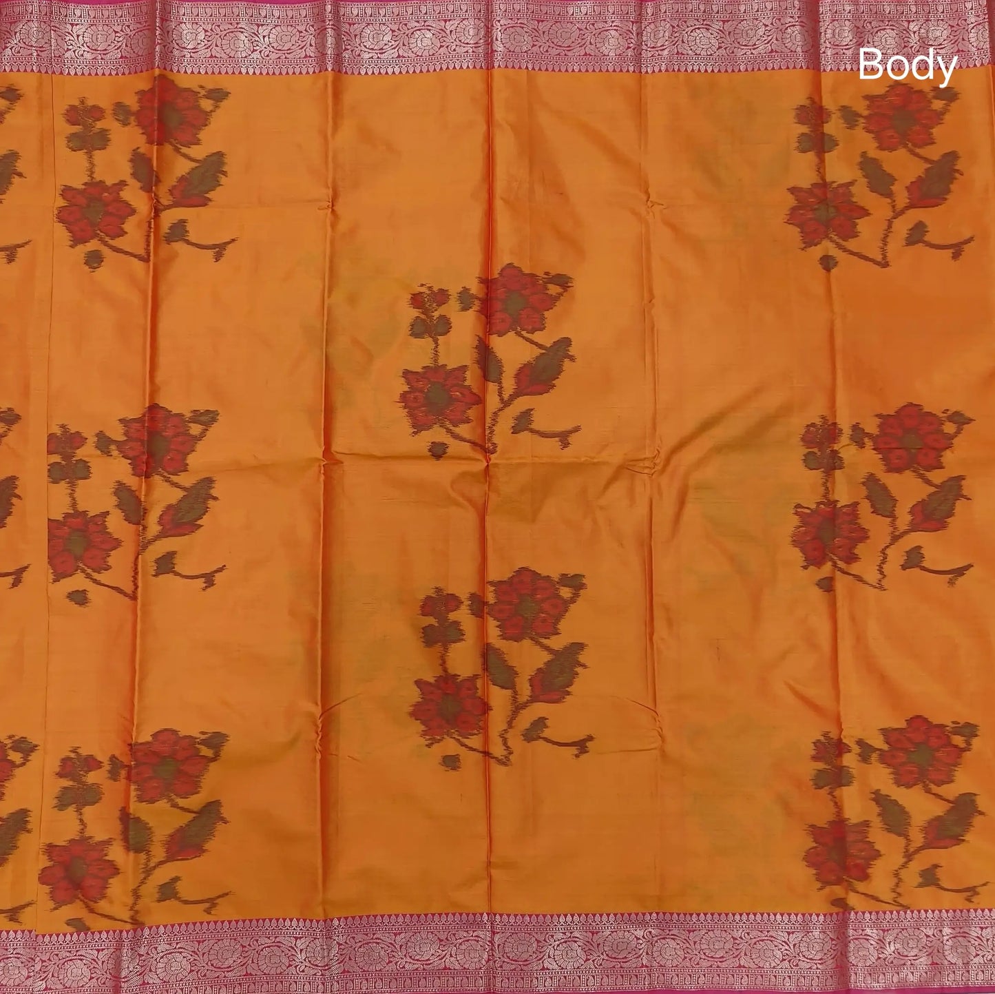 Orange dual shaded ikat printed soft silk saree with silver zari woven double side borders, contrast printed pallu, contrast running blouse with zari woven borders. NS97