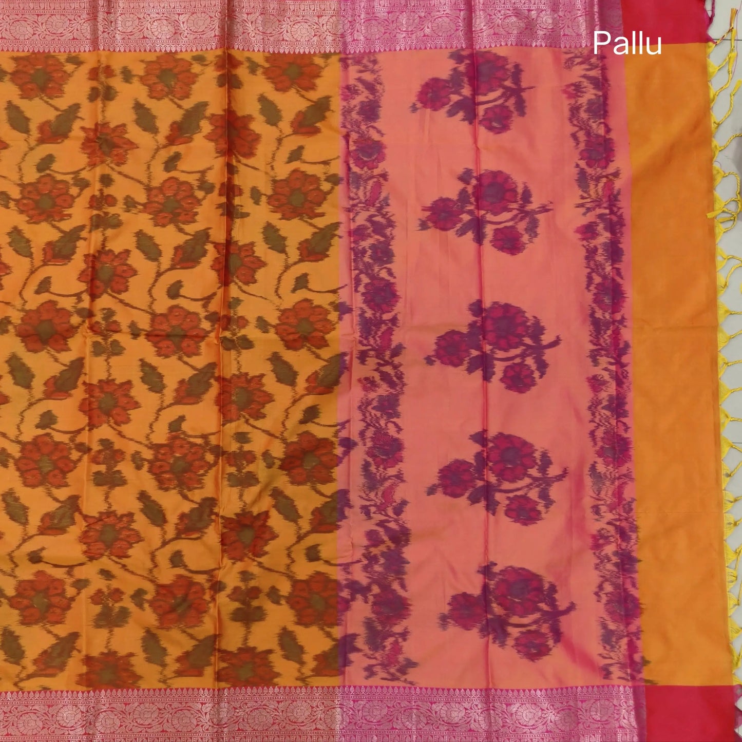 Orange dual shaded ikat printed soft silk saree with silver zari woven double side borders, contrast printed pallu, contrast running blouse with zari woven borders. NS97