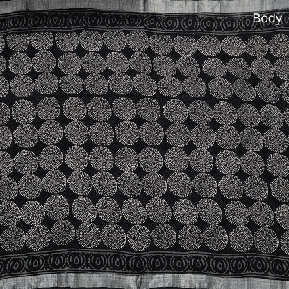Black block printed linen cotton saree with double side silver zari borders (lightweight,soft) printed pallu with silver zari stripes, plain running blouse with borders. NS111