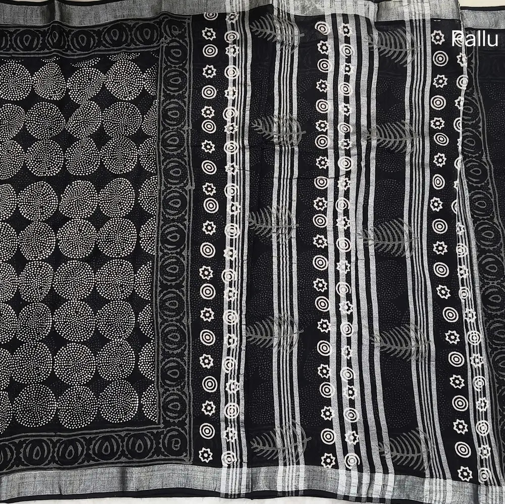 Black block printed linen cotton saree with double side silver zari borders (lightweight,soft) printed pallu with silver zari stripes, plain running blouse with borders. NS111