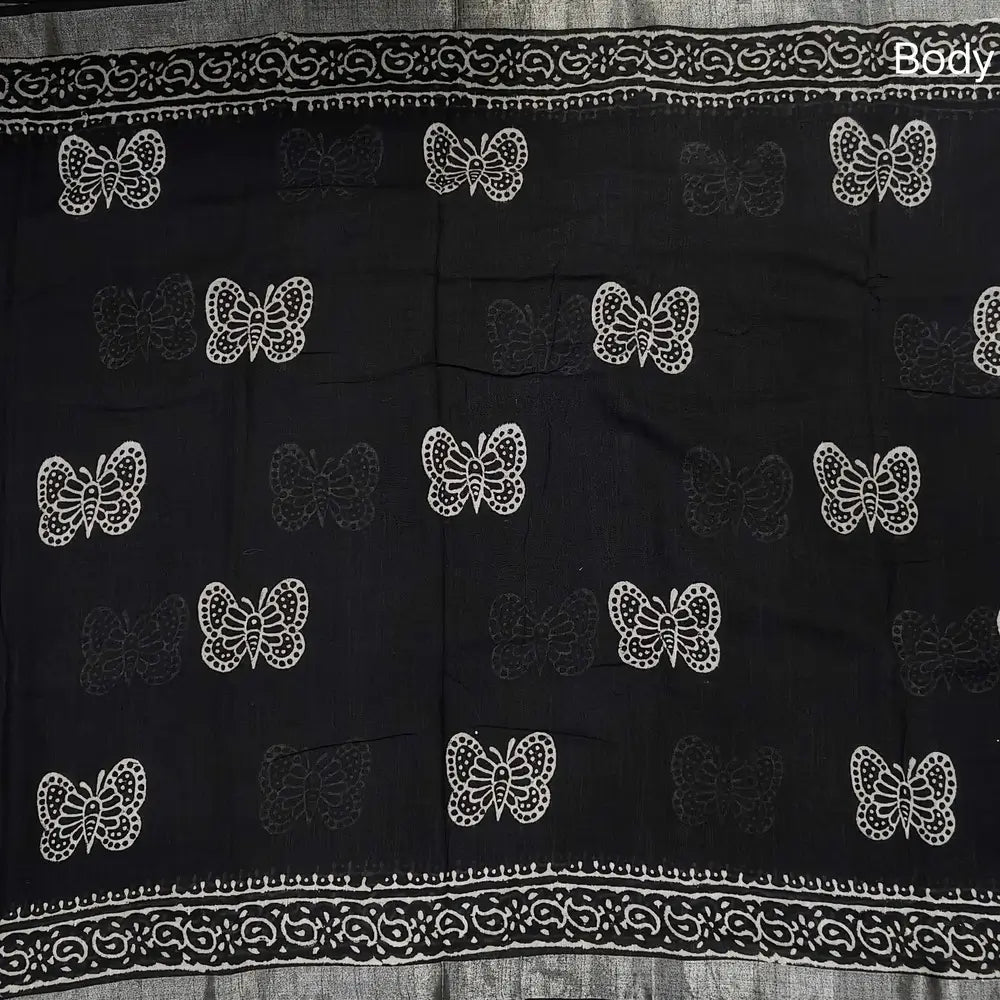 Black block printed linen cotton saree with double side silver zari borders (lightweight,soft) printed pallu with silver zari stripes, plain running blouse with borders. NS110