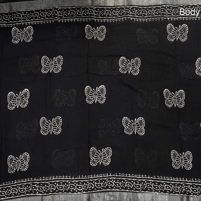 Black block printed linen cotton saree with double side silver zari borders (lightweight,soft) printed pallu with silver zari stripes, plain running blouse with borders. NS110