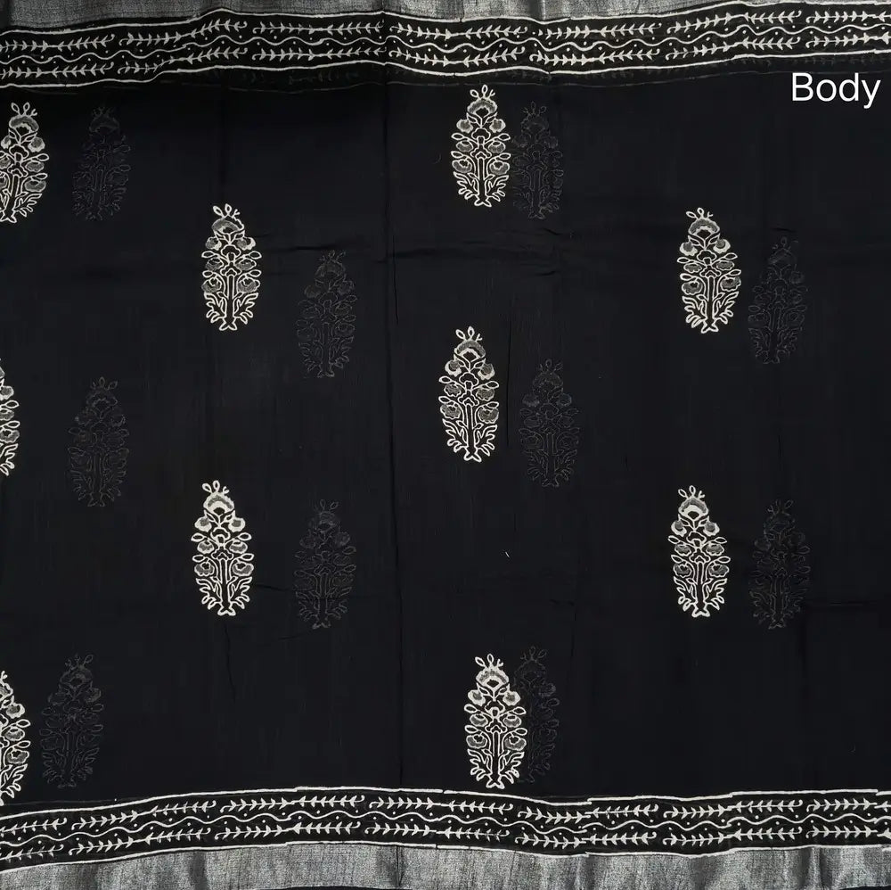 Black block printed linen cotton saree with double side silver zari borders (lightweight,soft) printed pallu with silver zari stripes, plain running blouse with borders. NS109