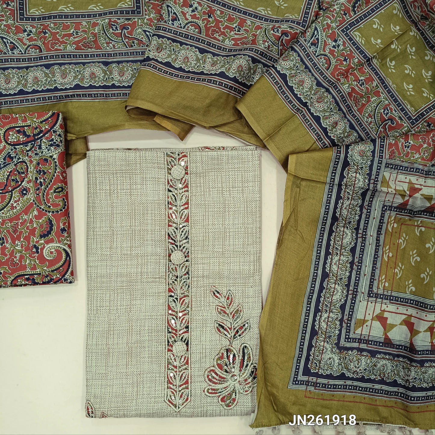 Beige pure soft cotton unstitched salwar material,embroidery, applique patch work on yoke,floral applique work on front(Brick red)(lining needed)printed cotton bottom, printed full length mul cotton dupatta. JN261918