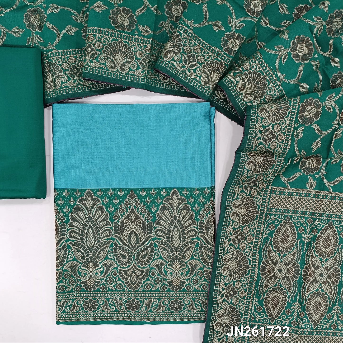 Pastel blue premium silk cotton unstitched salwar material, brocade weaving on daman,(Lining needed)Turquoise green  silk cotton bottom, brocade weaving on silk cotton full length dupatta with rich pallu and tassles. JN261722