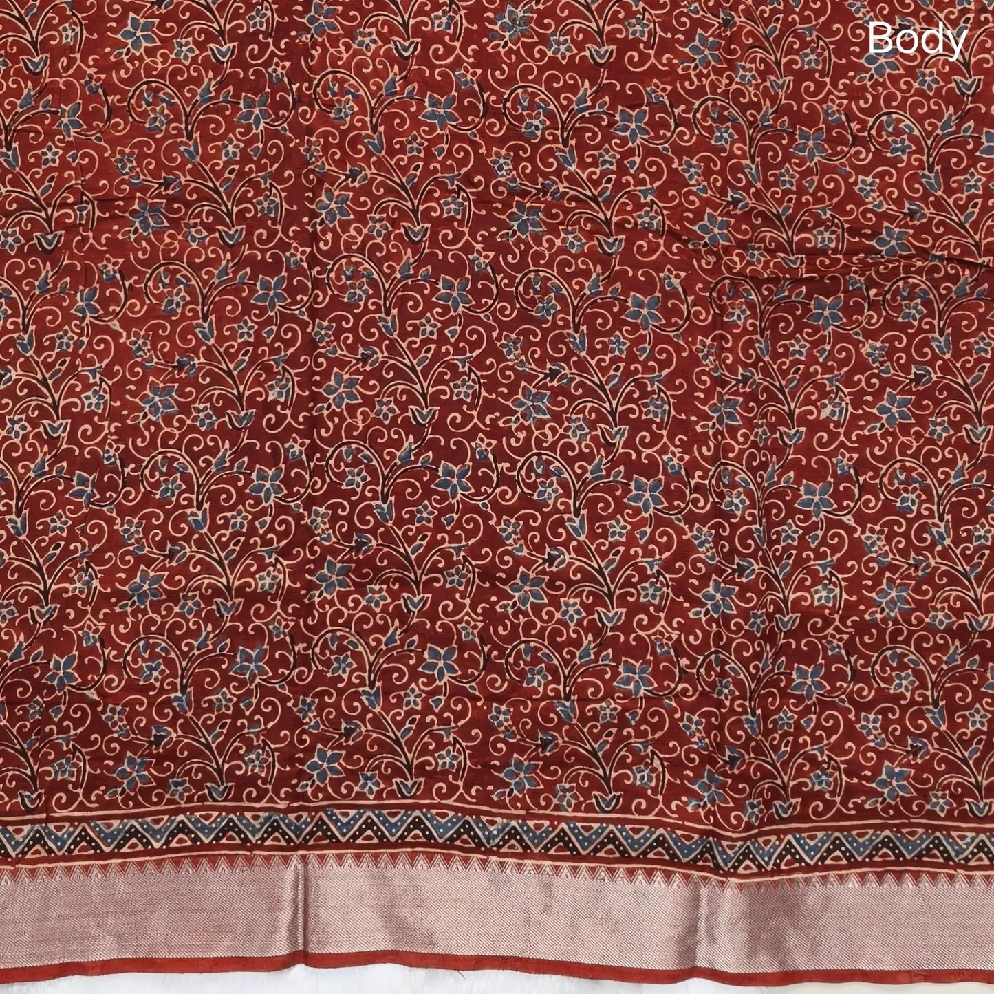 Reddish maroon ajrak hand block printed pure dola silk saree, benarasi zari woven double side borders, hand block printed pallu, running blouse with borders.(DRY CLEAN RECOMMENDED , MILD STAINS AND DYES ARE NOT DEFECTS). NS100