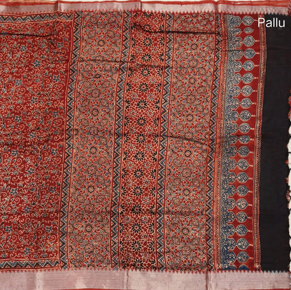 Reddish maroon ajrak hand block printed pure dola silk saree, benarasi zari woven double side borders, hand block printed pallu, running blouse with borders.(DRY CLEAN RECOMMENDED , MILD STAINS AND DYES ARE NOT DEFECTS). NS100